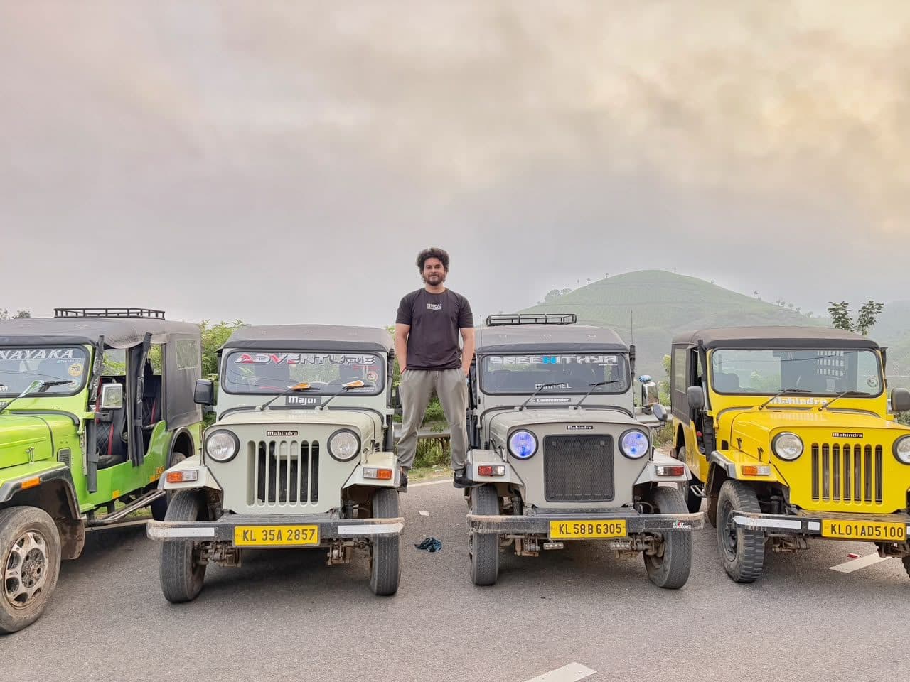 Safari jeeps lined up at the forest gate at first light
