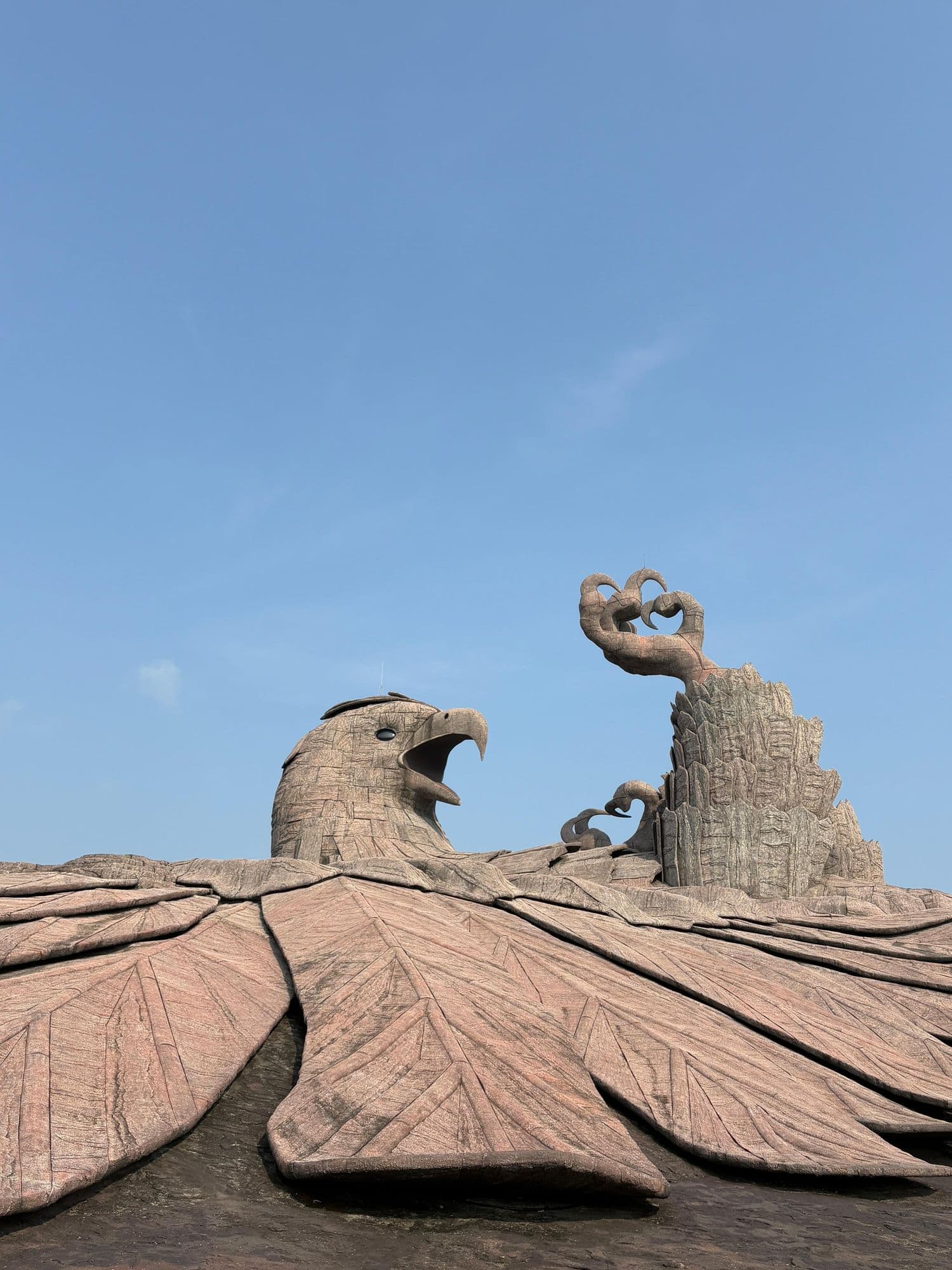 The Jatayu sculpture against a clear sky
