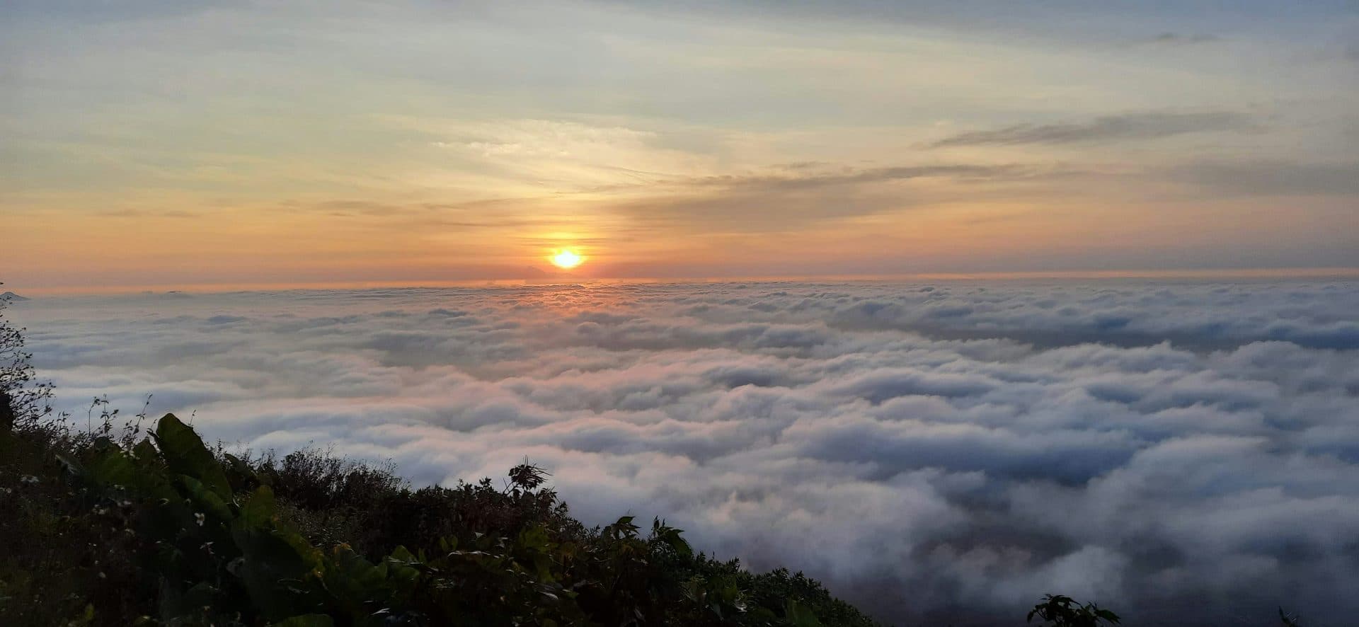 Sunrise over the Nandi Hills valley, riders silhouetted